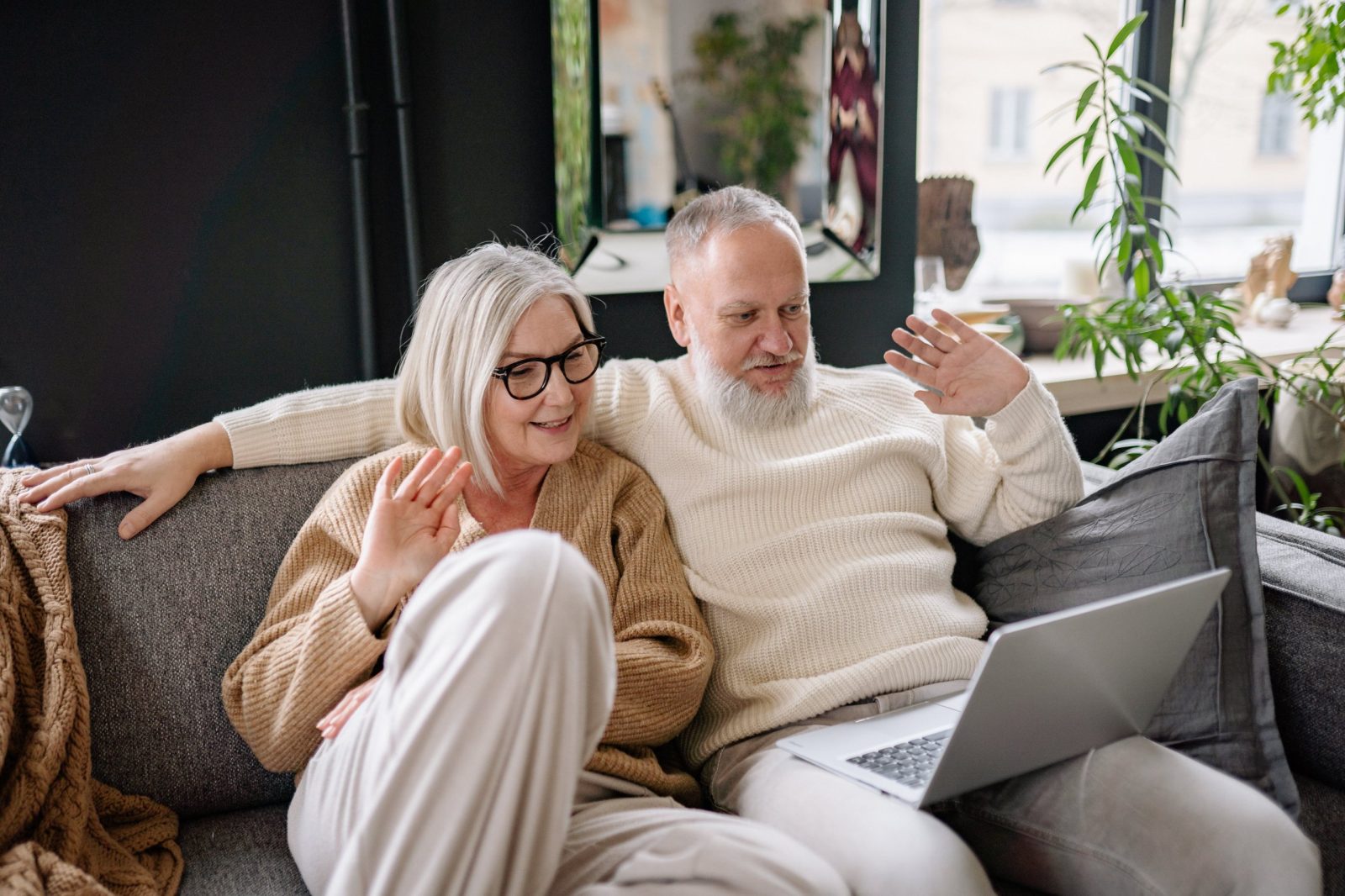 Seniors-on-beach-with-laptop